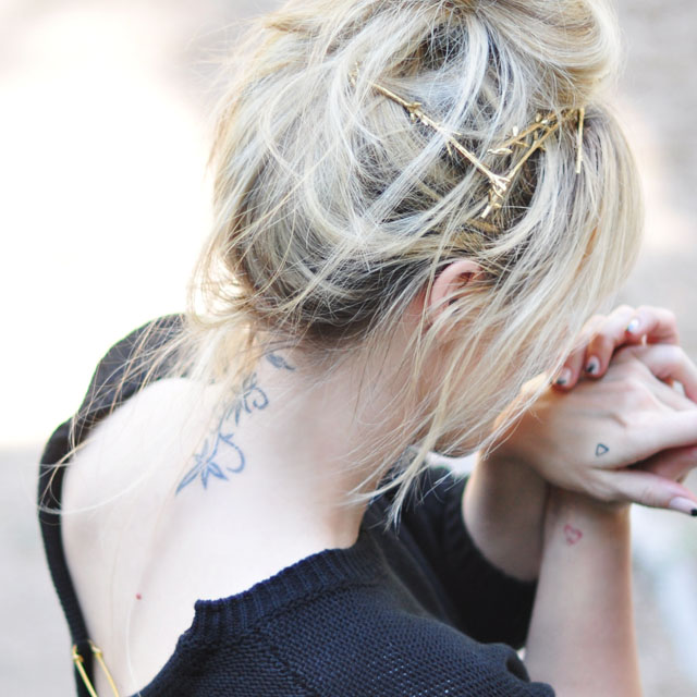 neck tattoo, messy bun, gold twig hair pins