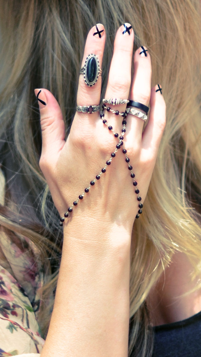 1 nude and black nails with x's