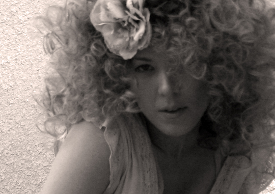 big blonde afro hair with sponge rollers