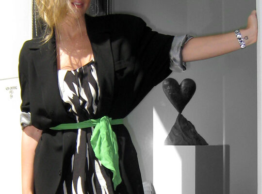 black and white dress with oversized blazer and green sash