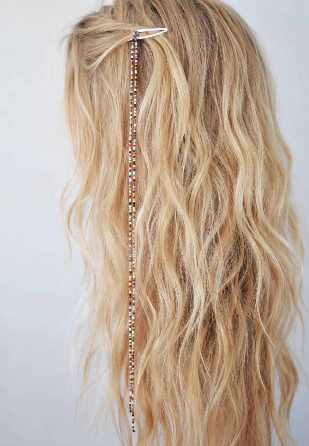 DIY beaded hair clip-hanging seed beads in blonde hair