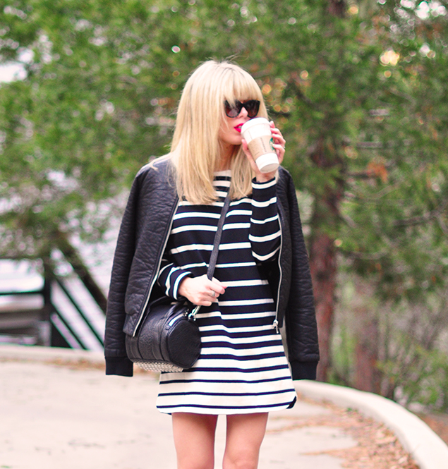 black and white striped dress, red lips, leather bomber jacket