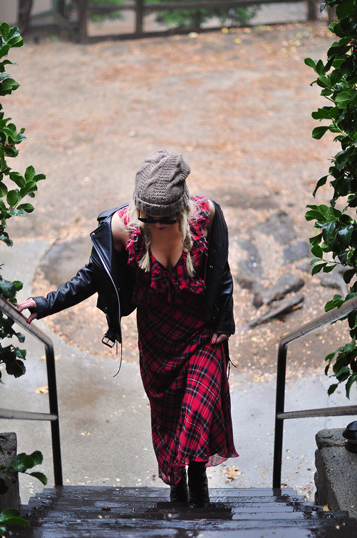 90s grunge look-plaid maxi dress-beanie-braids-leather biker jacket