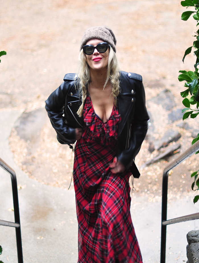 90s grunge look-plaid maxi dress-beanie-braids-leather biker jacket