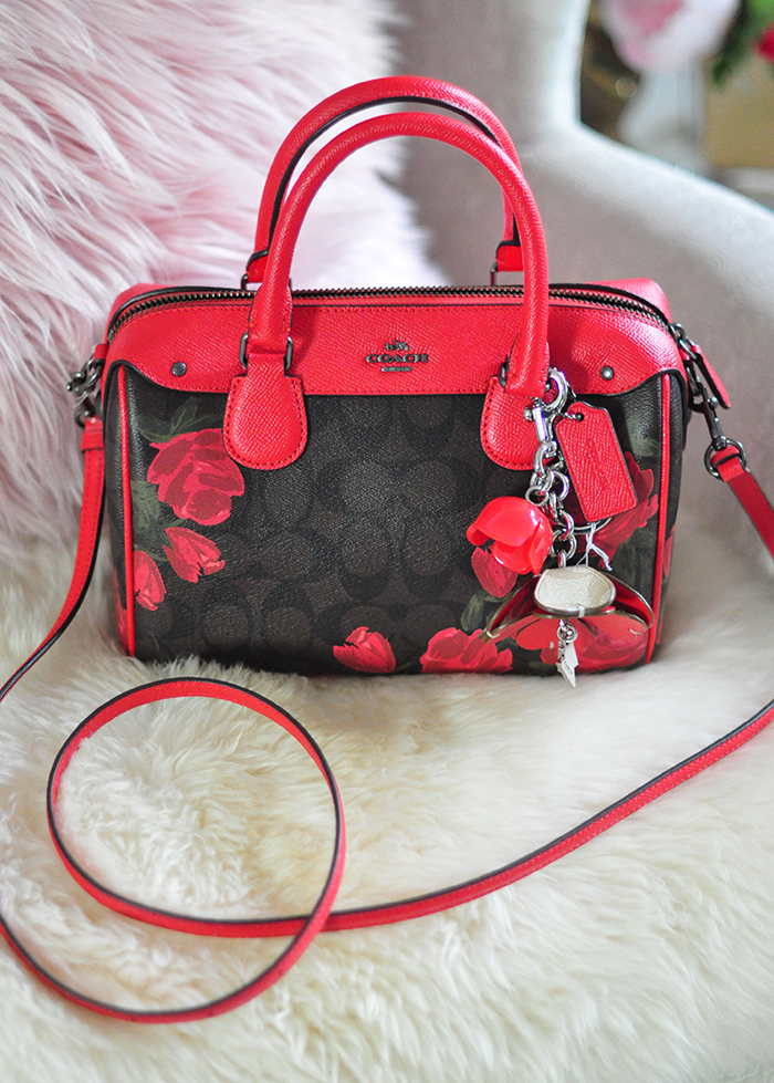 Coach logo bag with red roses and leather accents