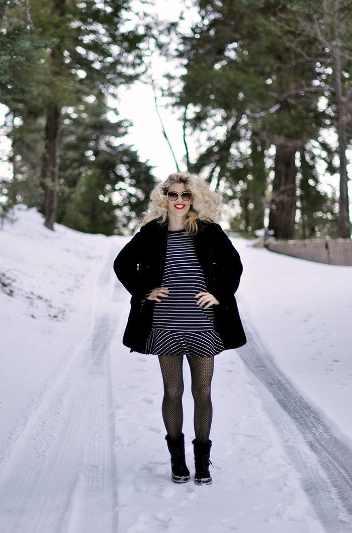 black striped dress in the snow-snow style-fishnets-sorel snow boots