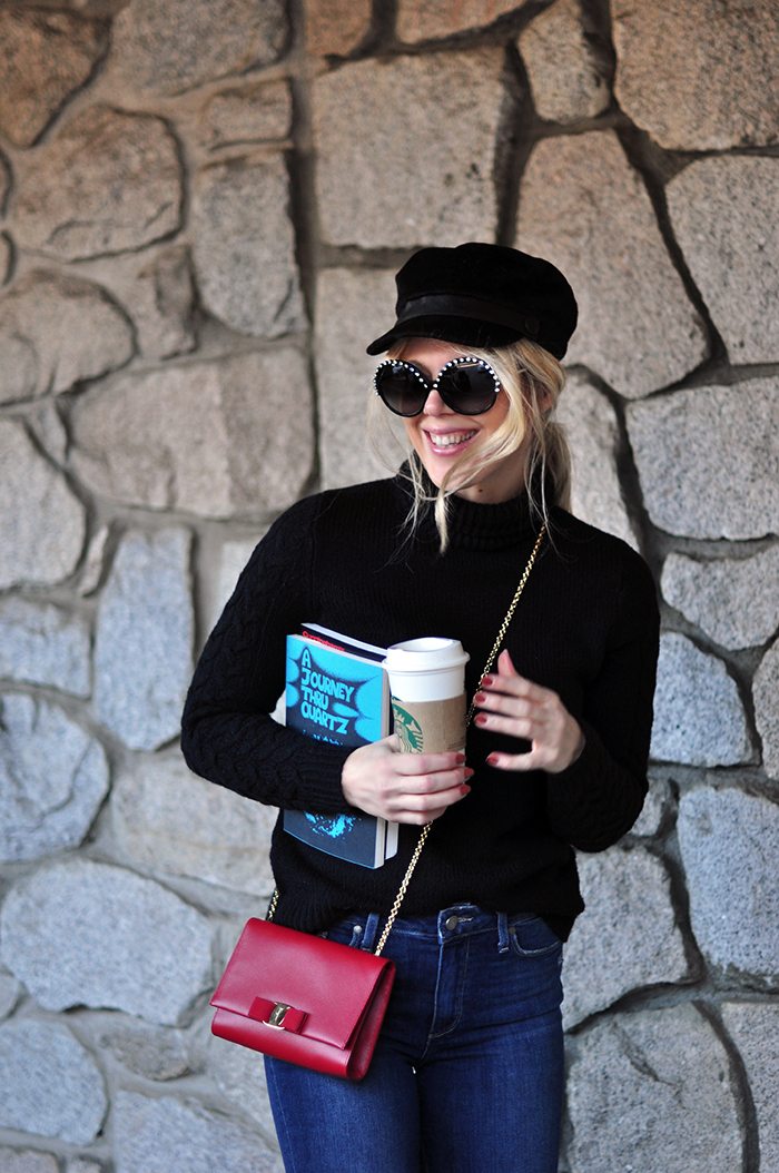 retro casual 60s style, big round embellished sunglasses, jeans and a turtleneck, red cross body bag, loafers, casual street style