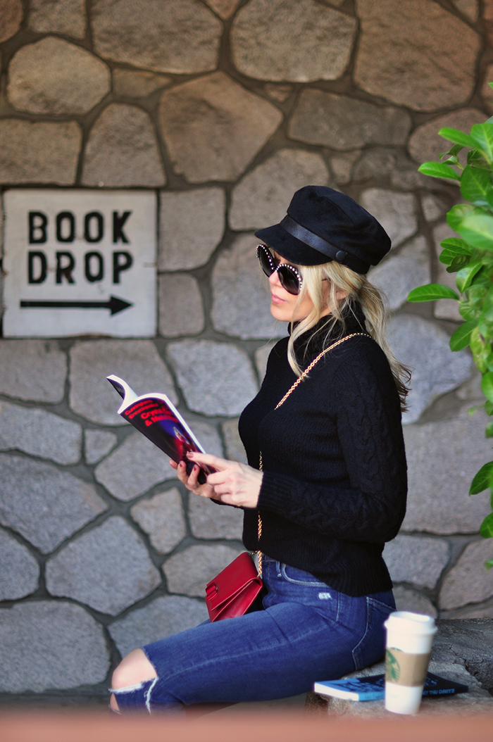 retro casual 60s style, big round embellished sunglasses, jeans and a turtleneck, red cross body bag, loafers, casual street style