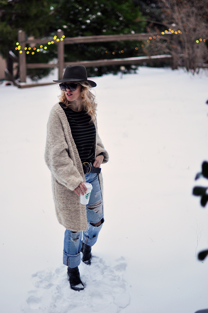 snow style, vintage levi's with fishnets, oversized cardigan, striped tee, wool fedora