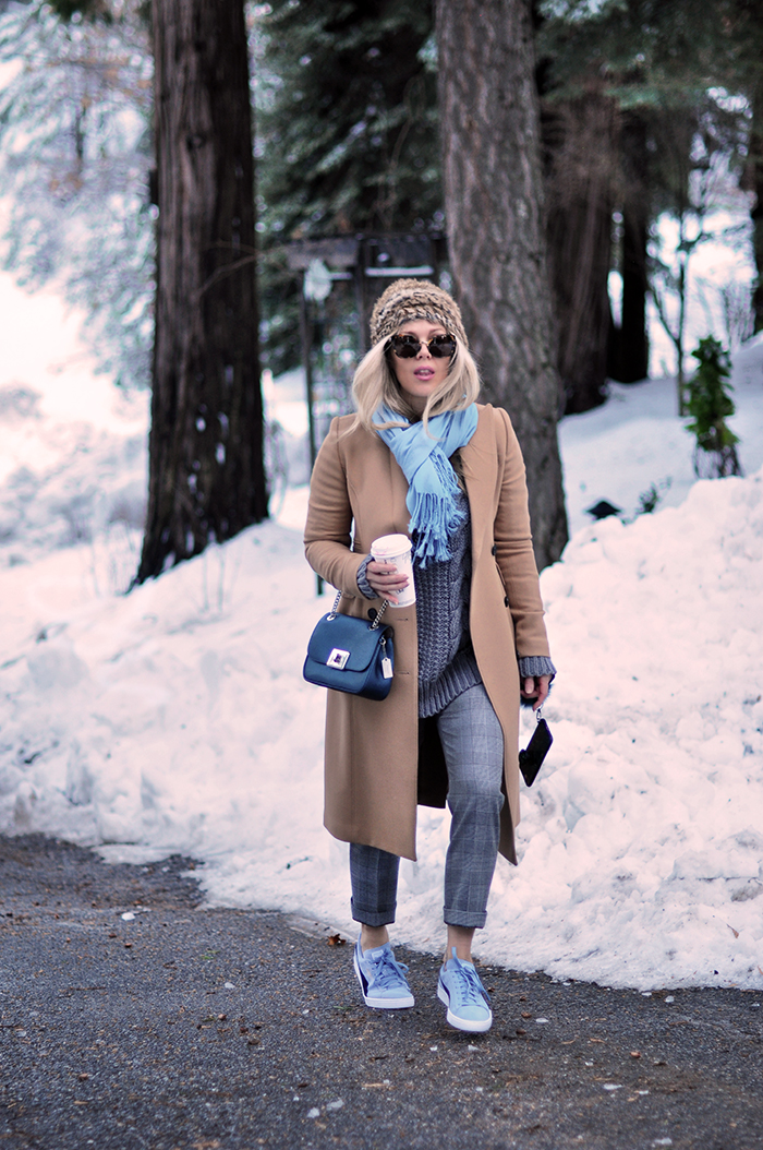 winter style in the snow, camel coat, plaid pants, sneakers with everything, love maegan tintari