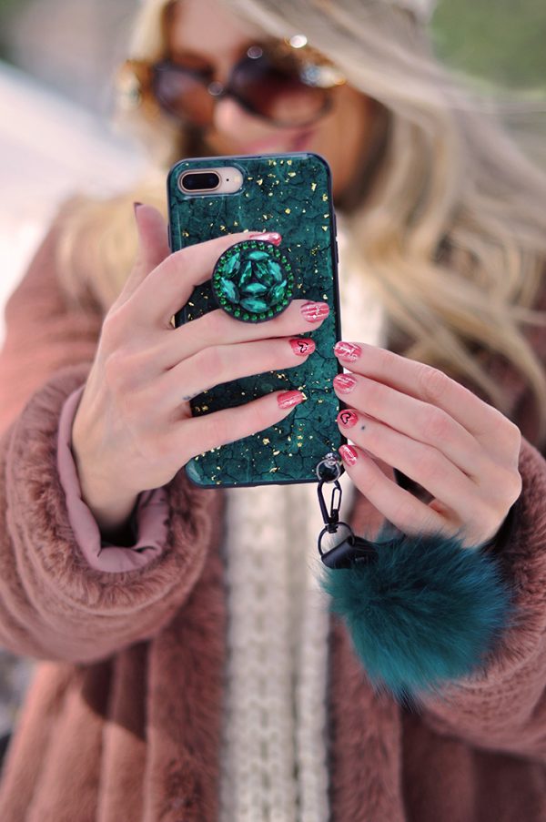 valentine's day nails- green and gold phone case with fur strap