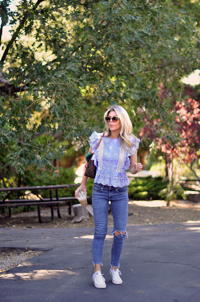 cute summer outfit - jeans and a cute ruffled top with converse sneakers