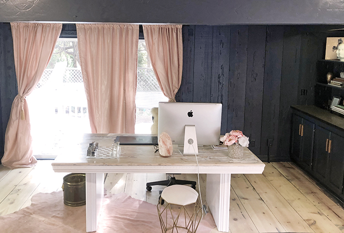 pretty office space, dark blue walls blush pink curtains, blogger offices