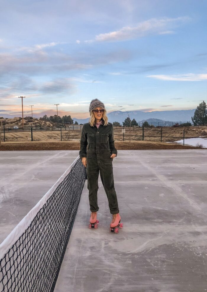 roller skating at sunset in lake arrowhead on pink moxi lolly roller skates and corduroy lee coveralls in the winter