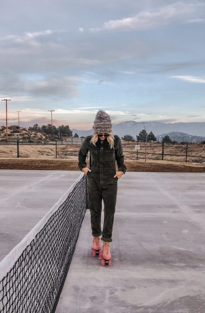 roller skating at sunset in lake arrowhead on pink moxi lolly roller skates and corduroy lee coveralls in the winter