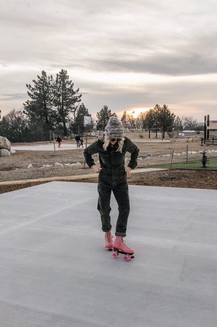 roller skating at sunset in lake arrowhead on pink moxi lolly roller skates and corduroy lee coveralls in the winter