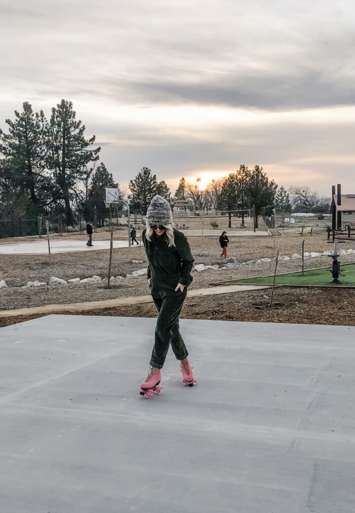 roller skating at sunset in lake arrowhead on pink moxi lolly roller skates and corduroy lee coveralls in the winter