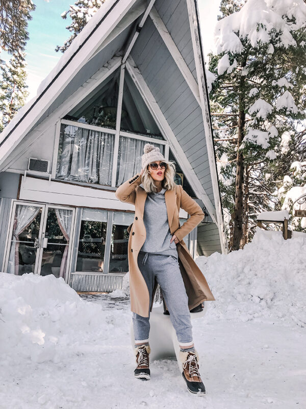 grey sweat suit with camel coat-snow in lake arrowhead-a-frame cabin-love maegan winter style