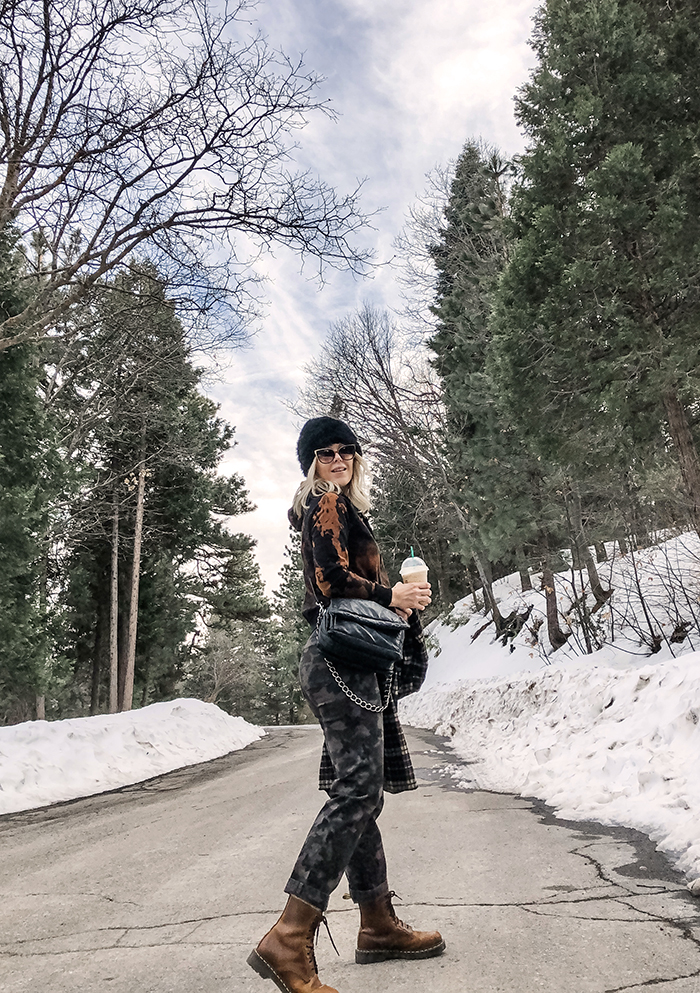 winter outfit in the snow in lake arrowhead, camo pants, bleach dye tie dyed black hoodie sweatshirt, black beanie, docs, outfit with dr martens, lake arrowhead snow