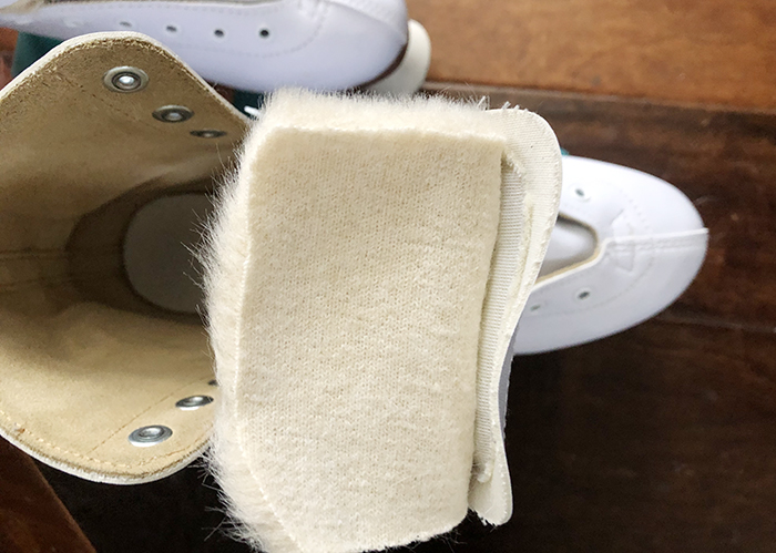 DIY Faux fur roller skate lining, how to get your skates to fit better when they're too big, white retro roller skates with teal bont wheels and derby laces