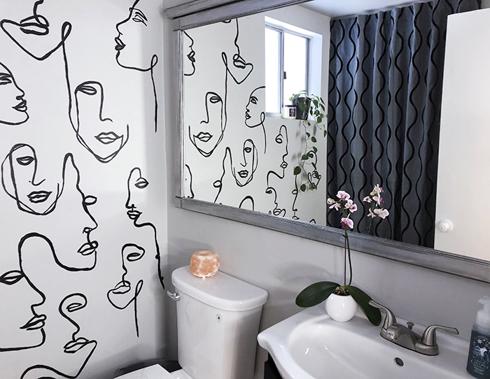 before and after small bathroom makeover with hand painted wall line art faces on the wall, wall paper alternative, drawing on walls, wall mural, accent walls
