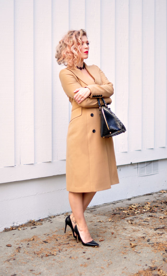 vintage black slip dress with camel coat and heels