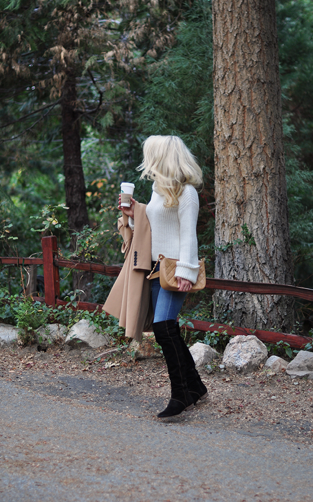 jeans and over the knee boots with an oversize turtleneck and camel coat