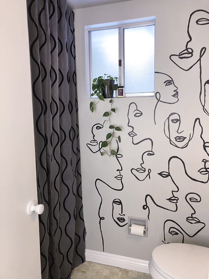 before and after small bathroom makeover with hand painted wall line art faces on the wall, wall paper alternative, drawing on walls, wall mural, accent walls