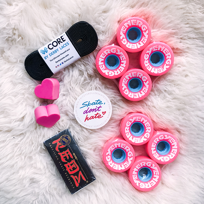 roller skate accessories, energy radar wheels, heart toe stops, derby laces, black suede roller skates with pink wheels, black moxi panthers, panthers, roller skates