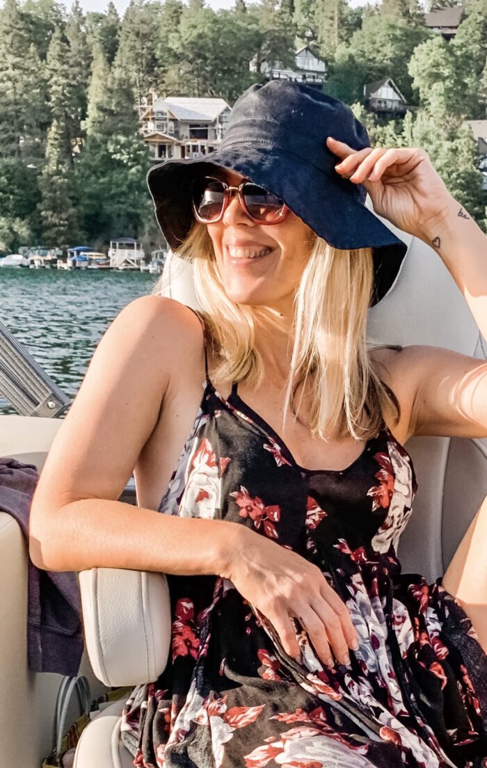 floral sun dress with bucket hat on the boat in lake arrowhead