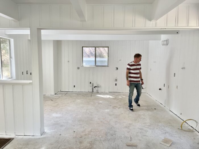 painted white interior, painted brick fireplace mantel, 60s lake house in lake arrowhead