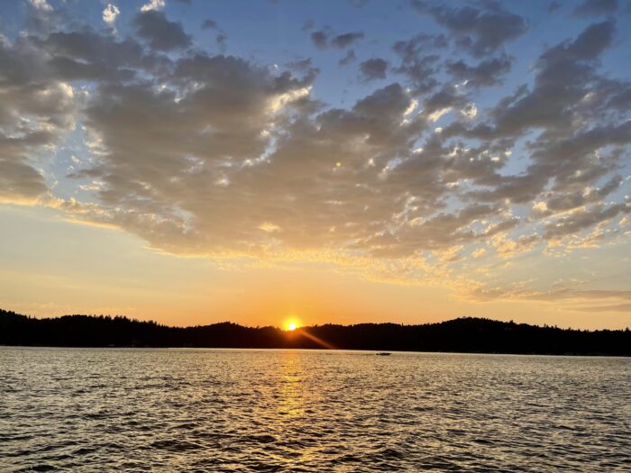 sunset on the lake, reflection in the water, orange sunsets, cloudy skies, lake arrowhead