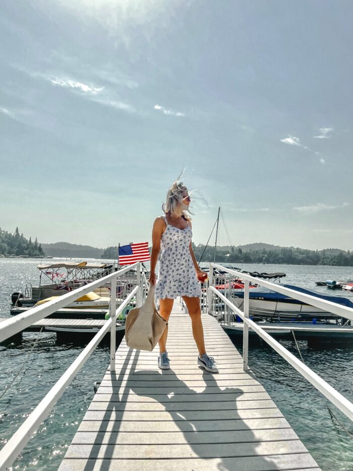 white sundress with blue flowers, on the lake, lake arrowhead, water, seascape, lakes in california, lakes near los angeles, summer style, lake life, lake dress, on a dock, boat life, docks in lake arrowhead, summer fashion