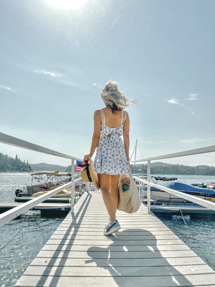 white sundress with blue flowers, on the lake, lake arrowhead, water, seascape, lakes in california, lakes near los angeles, summer style, lake life, lake dress, on a dock, boat life, docks in lake arrowhead, summer fashion