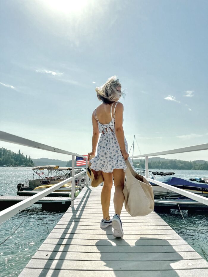 white sundress with blue flowers, on the lake, lake arrowhead, water, seascape, lakes in california, lakes near los angeles, summer style, lake life, lake dress, on a dock, boat life, docks in lake arrowhead, summer fashion