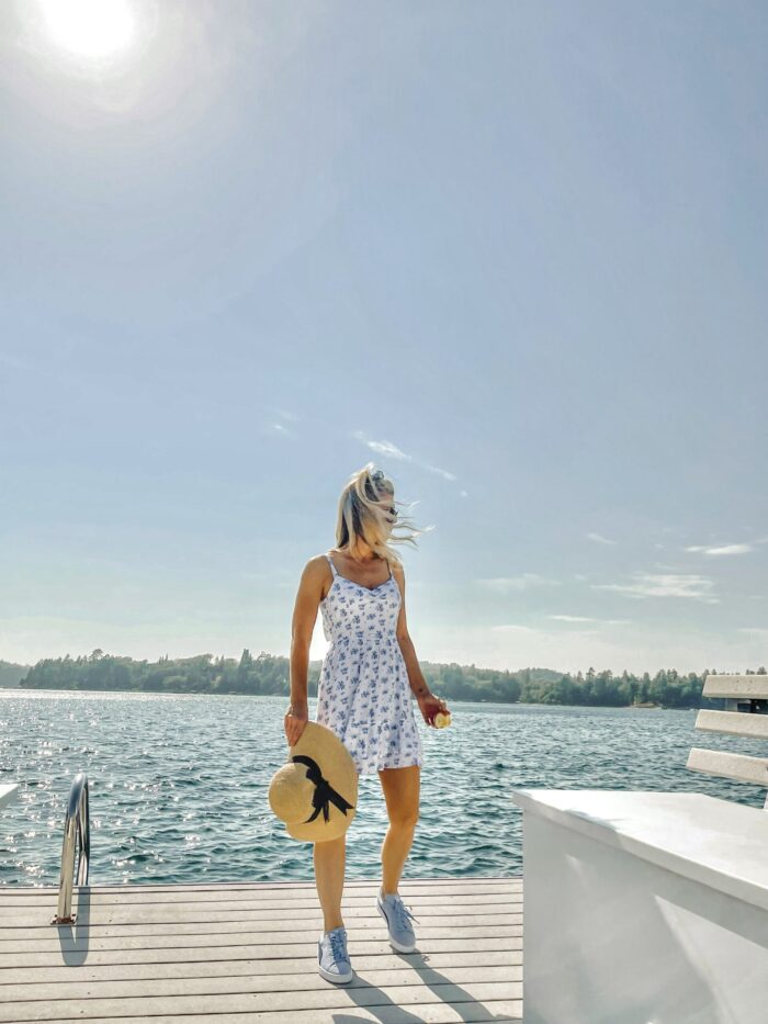 white sundress with blue flowers, on the lake, lake arrowhead, water, seascape, lakes in california, lakes near los angeles, summer style, lake life, lake dress, on a dock, boat life, docks in lake arrowhead, summer fashion