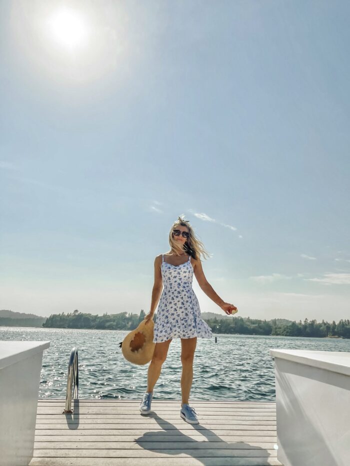 white sundress with blue flowers, on the lake, lake arrowhead, water, seascape, lakes in california, lakes near los angeles, summer style, lake life, lake dress, on a dock, boat life, docks in lake arrowhead, summer fashion