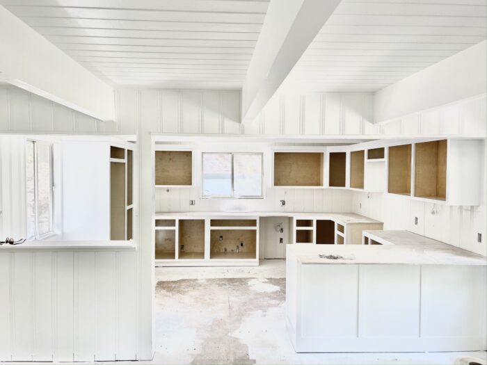 all white kitchen renovation cabinets with peninsula instead of island