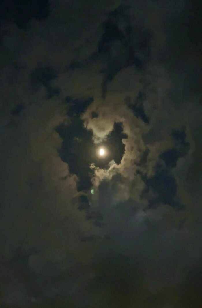 heart shaped cloud around the moon at night