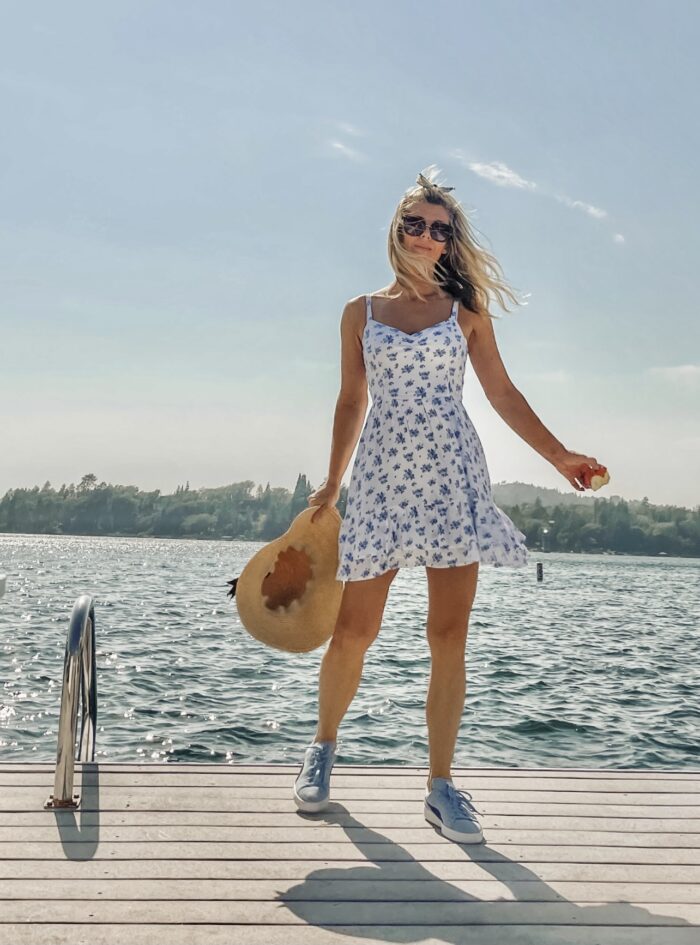 on the dock on the lake in lake arrowhead, summer, sun dress, floral sundress, white dress with blue flowers, dresses with sneakers, dresses with tennis shoes, blue, seascap, love maegan