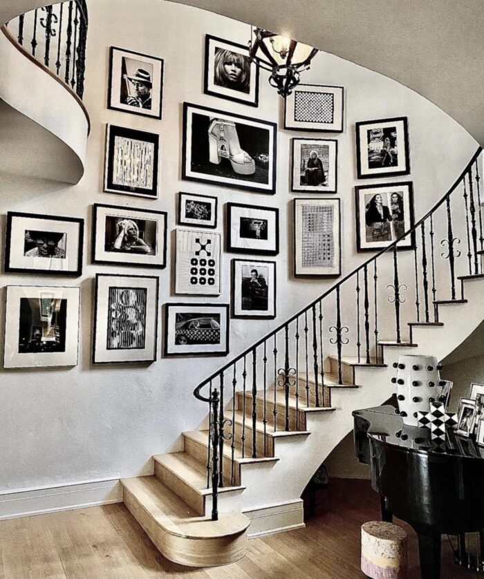 art and interiors, photography, art gallery, home decor, decor ideas, decorating with art, how to add art into your home, large scale photography, grand stairway, art gallery wall, art wall, black and white photo art gallery wall