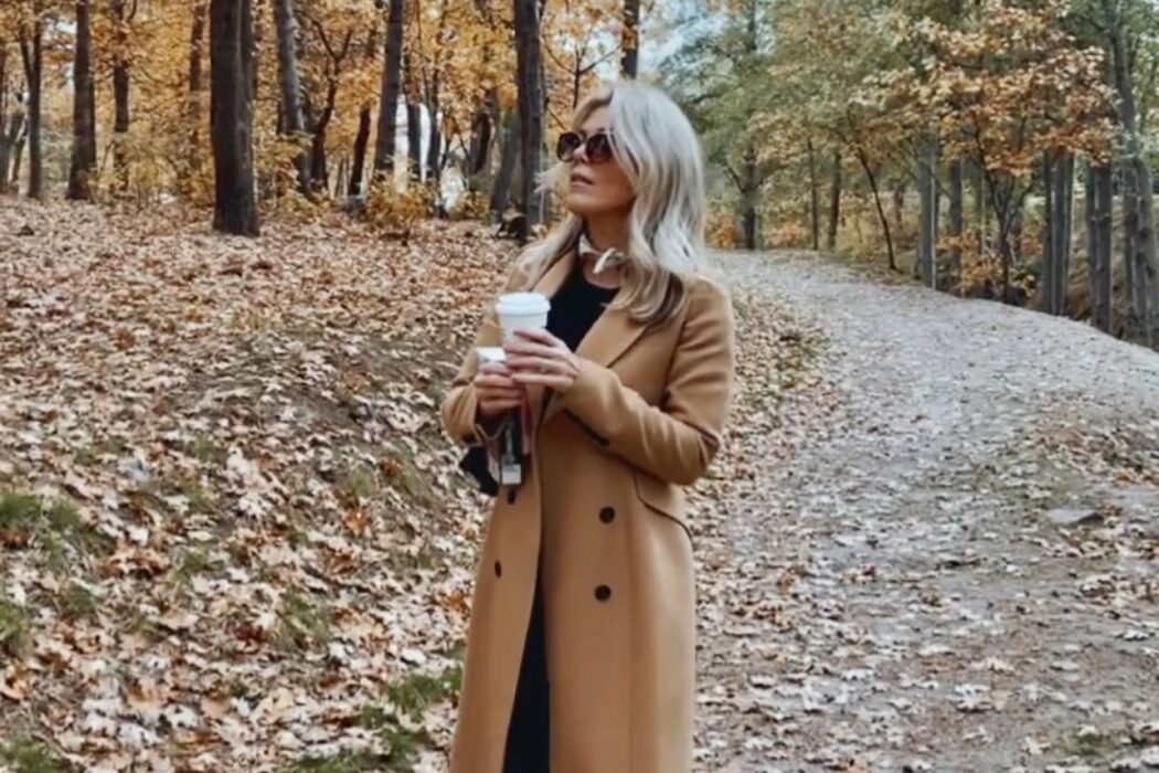 fall style, camel coat, tree lined street, fall colors, falling leaves, orange leaves, autumn, fall aesthetic, style over 40, camel and black outfit