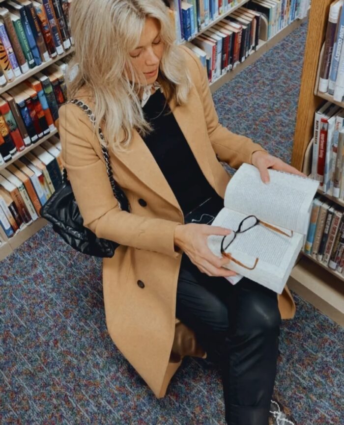 in the library, library books, books, library aesthetic, camel coat, snakeskin loafers, black outfit, faux leather pants, library style, fall style, lake arrowhead library, blonde with glasses, in the library