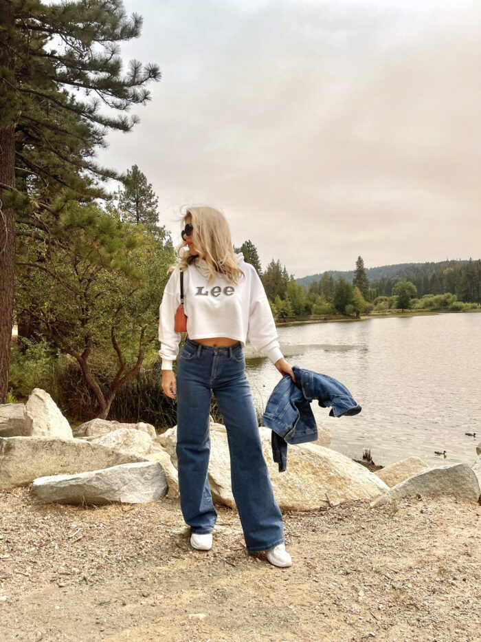 lee, lee jeans, 90s look, cropped hoodie sweatshirt, high rise a line wide leg jeans, nikes, denim, lake arrowhead, pretty sky, nature, girl standing in front of a lake