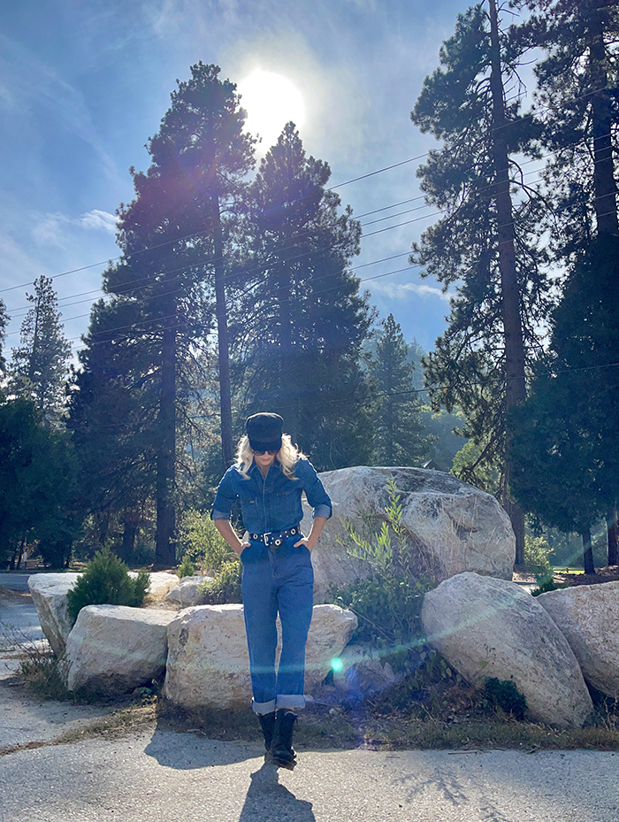 lee denim coveralls, denim jumpsuit, woman sitting on large rocks, blue skies, tall trees, lake arrowhead, bloggers in LA