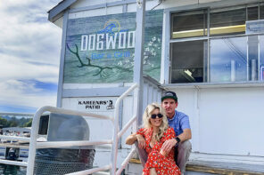 Owners Chad and Maegan sit in front of Dogwood Dockside at the lake arrowhead marina - used to be jake's on the lake