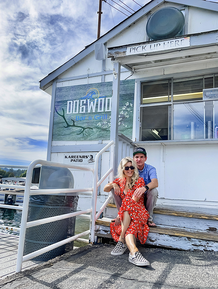 Owners Chad and Maegan sit in front of Dogwood Dockside at the lake arrowhead marina - used to be jake's on the lake