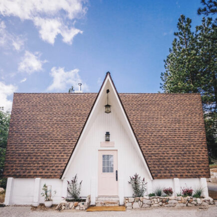 the little apple a-frame in lake arrowhead running springs white a-frame cabin with pink door for sale california