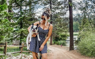 summer dress-summer style-girl holding a french bulldog-style over 40-summer dress and clogs-crocs