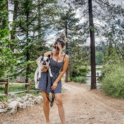 summer dress-summer style-girl holding a french bulldog-style over 40-summer dress and clogs-crocs
